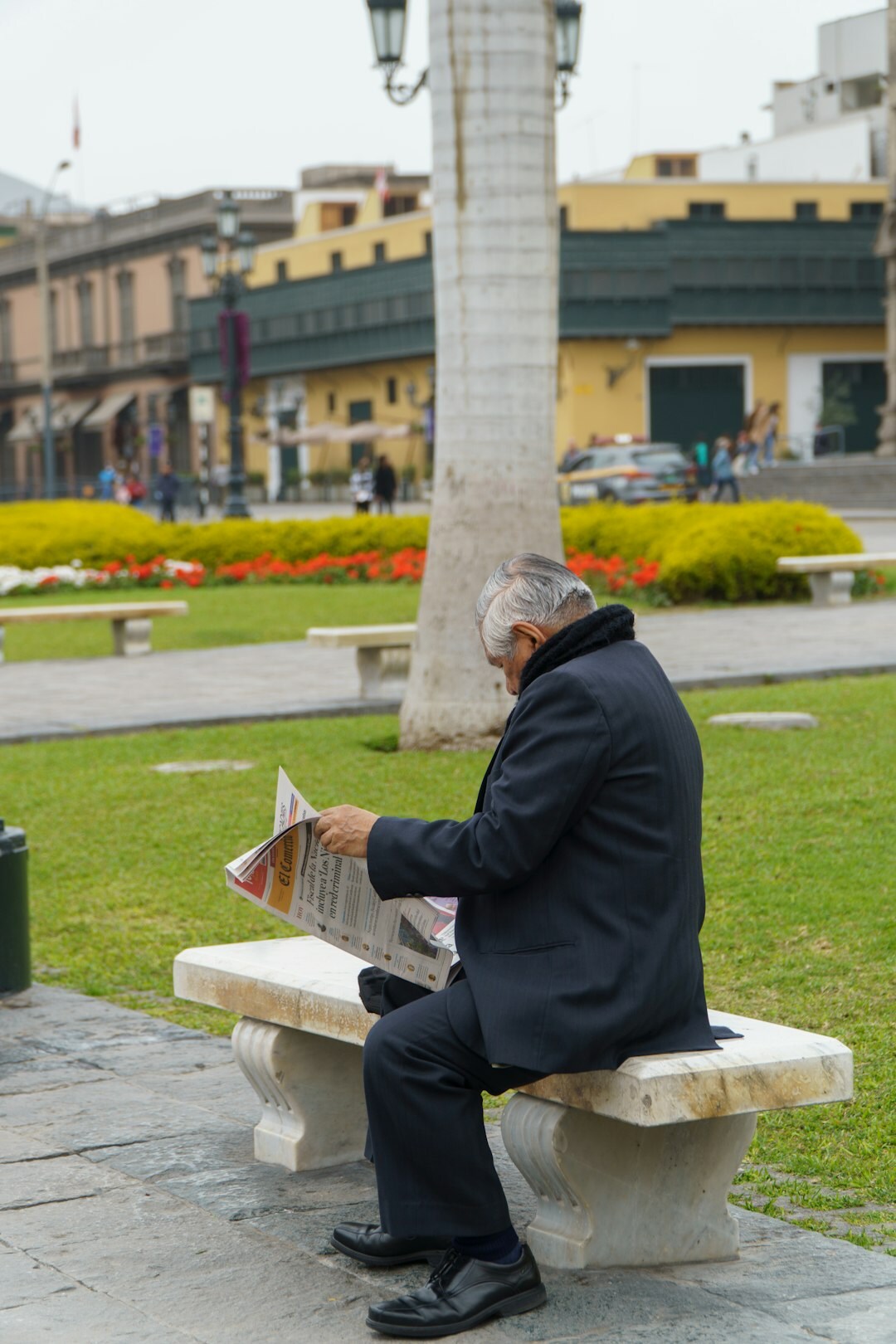 senior reading newspaper